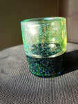 green and black shotglass