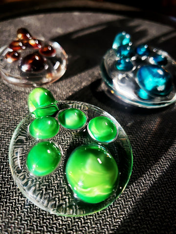 green paw print pendy